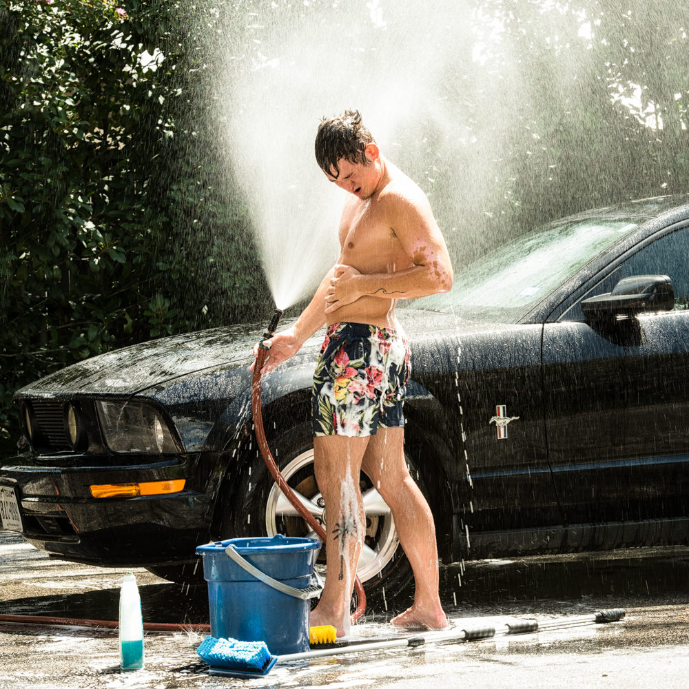 Steamy car wash with a male model in Houston, Tx
